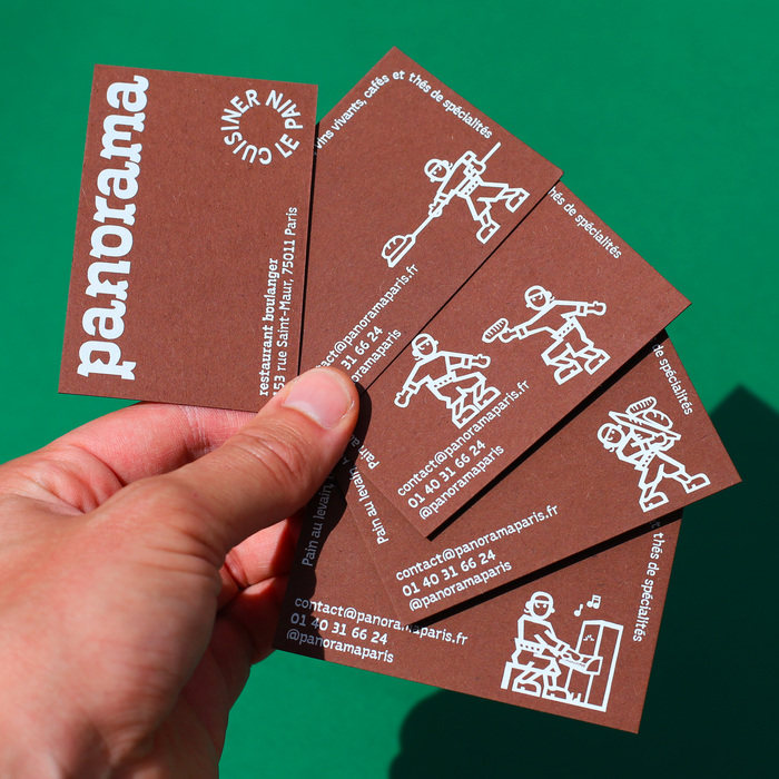 Screen-printed business cards, light grey on brown paper, withwenty-five different illustrations on the back.
