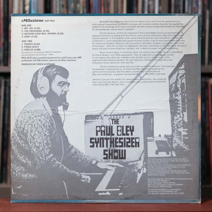 The back cover repeats the title in Template, here shown integrated in a photo of Bley’s audio equipment. Track list, credits, and the liner notes by Michael Cuscuna (1948–2024) are set in . The Milestone logo uses  Italic with a swash initial.