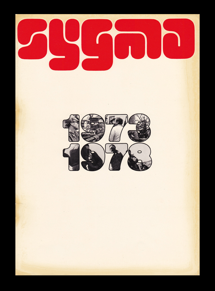 Cover of a Sygma brochure, 1973–1978. The outlined numerals filled with images are probably custom.  Extra Bold traced with rounded corners would come very close.