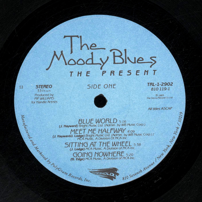 On the record labels, the typeface roles are reversed: Benguiat Gothic is used for the titles and Greeting Monotone for the band name, here with the swashy alternate M and the terminal forms for e and d (also in medial position), but not with the Th ligature.