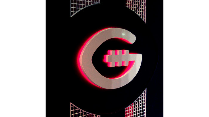 The metal ‘G’ is backlit with RGB LEDs which can be modified to get as close as possible to PMS #1797 which is the red used for the brand.