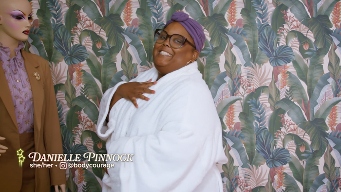 Screenshot from Season 2, Episode 6. The text reads “Danielle Pinnock, she/her, @bodycourage”. Rafaella is used for the name. All other text is in Proxima Nova.