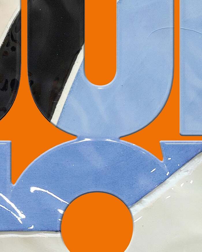 Detail showing the glazed ceramic letters