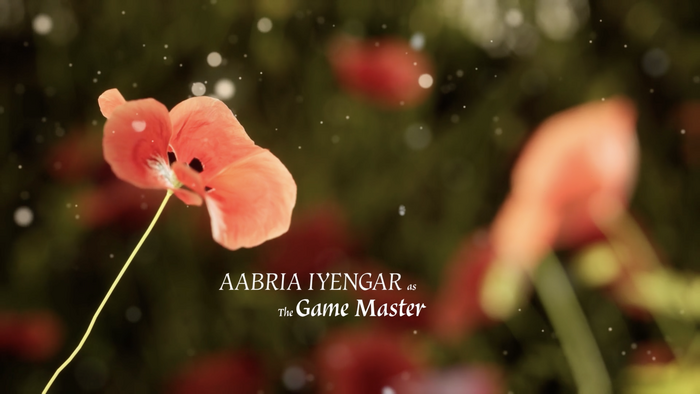 Screenshot from the opening credits sequence of episode 1. The text reads “AABRIA IYENGAR as The Game Master”, set in Vatican.