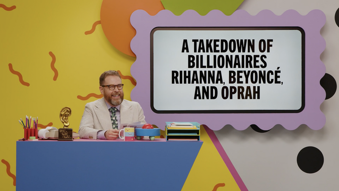Screenshot of Season 3, Episode 19, “A Takedown of Billionaires Rihanna, Beyoncé, and Oprah”.

Pictured: Sam Reich smiling gleefully at his desk, with the episode’s title prompt displayed on screen in Trade Gothic Next Heavy Compressed.