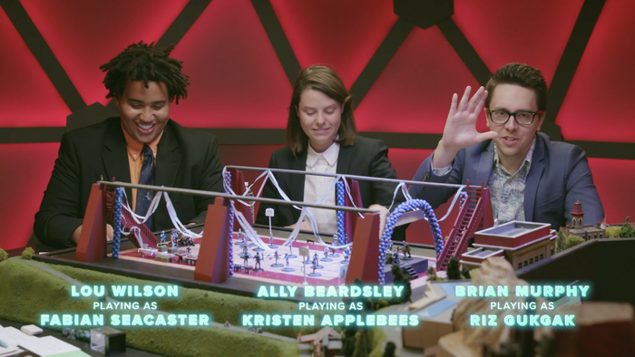 Screenshot of Episode 16, Prompocalypse. Pictured is Lou Wilson, Ally Beardsley, and Brian Murphy with their names and characters displayed below them in Proxima Nova.