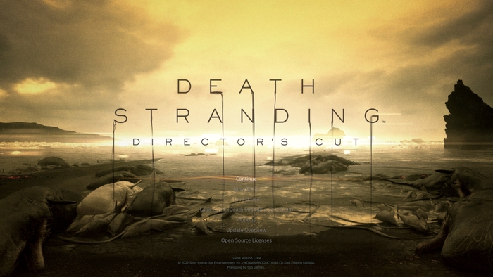 The main menu for Death Stranding: Director’s Cut. Note the usage of long way strands for the selected button, a visual motif that is repeated throughout the game.