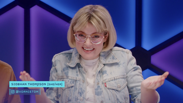 Screenshot of Episode 1, Summer Scaries

Siobhan Thompson playfully shrugging her shoulders towards the camera. Her name, pronouns, and Instagram handle are displayed in Cholla Unicase in the bottom left corner.