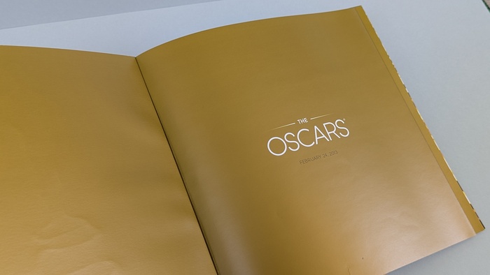 Title page of the official program: gold metallic finish featuring the official 85th Academy Awards logo