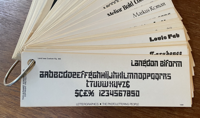 Glyph set for Langdon Biform with its fifteen alternates, as shown in the “Do a Comp” fan by Lettergraphics International Inc., 1968–1975