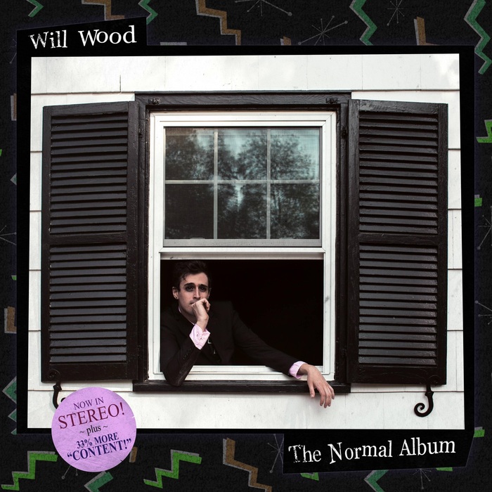Another The New Normal! Album cover found through Apple Music.

Will Wood rests one elbow on the banister, holding his fist to his chin, while his other arm rests out the window as looks out the window longingly. The promotional sticker reads “NOW IN STEREO! ~ plus ~ 33% MORE ‘CONTENT!’”
