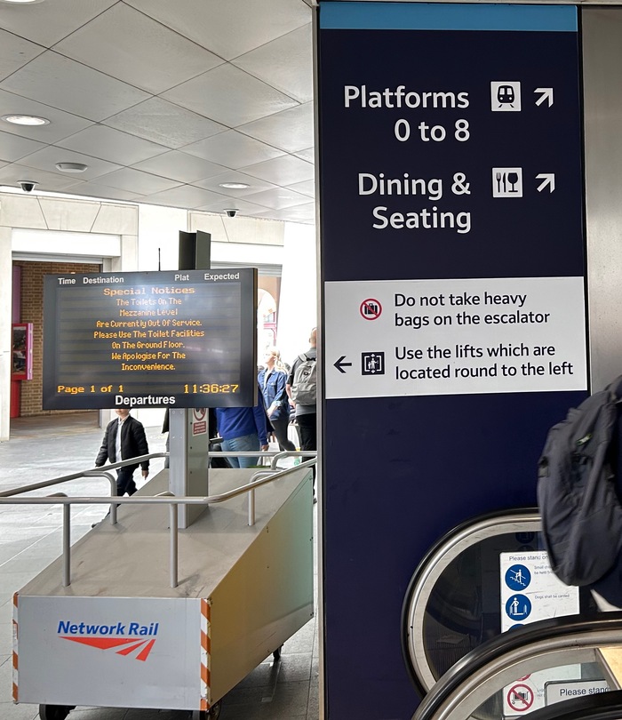 Photograph taken at Kings Cross 29 May 2025; type in both white on dark blue and black on white