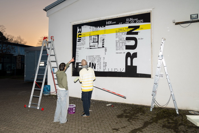 The billboard, freshly prepared for the occasion. Saleh Alsaid and Matti Henn discussing application fine-tuning.