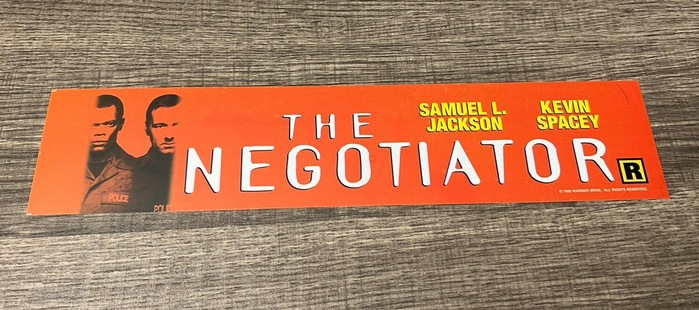 The actors’ names here are set in caps from Neue Helvetica Condensed, probably the 107 Condensed Extra Black style.