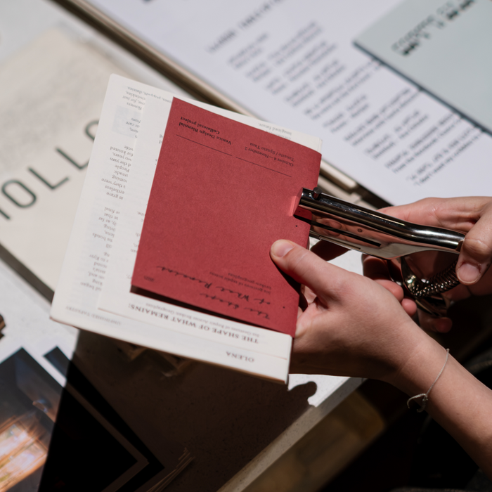 The exhibition booklet was left unbound so that visitors could pick the stories they wanted to take home and bind the booklet themselves in the exhibition space (all binding materials were provided).