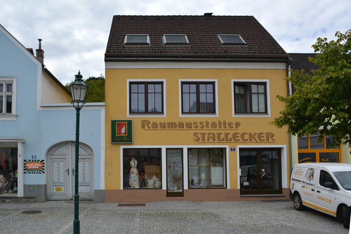 The business’s new location with the name in bichromatic 