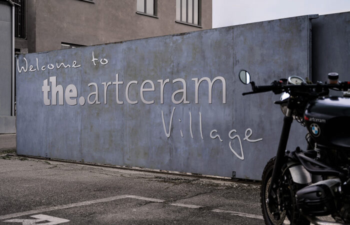 Entrance to the company’s location in Civita Castellana, Italy. The accompanying handwriting font is .