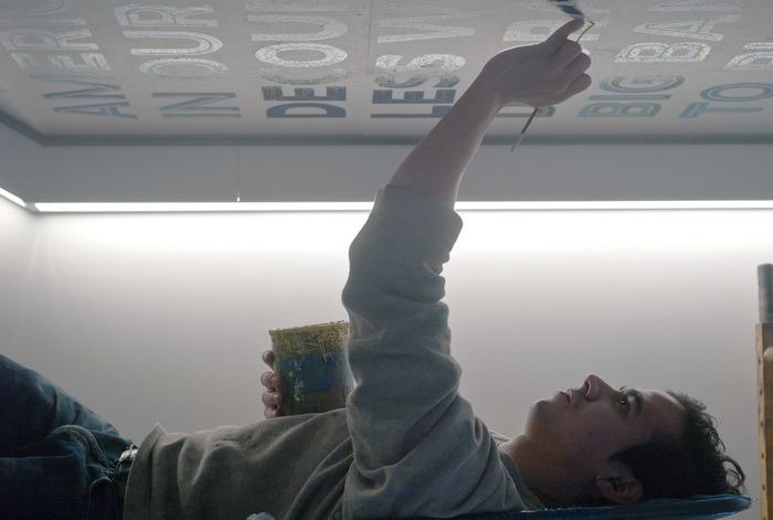 Flip-flop: hand-painting Ruedi Baur’s customized Irma on a ceiling at the New School. 