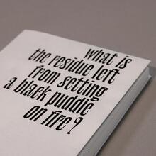 <cite>What is the residue left from setting a black puddle on fire?</cite> by Nesrine Salem