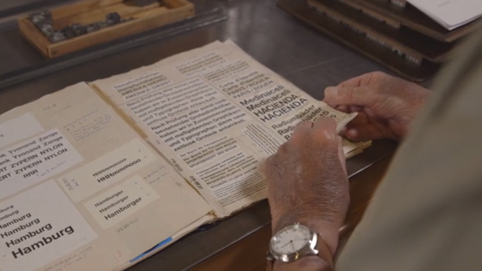 Alfred Hoffmann going through his father’s “Helvetica journal”. Still from the promotional film.