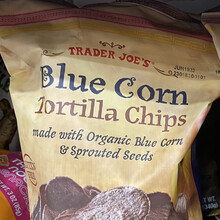 Trader Joe’s packaging for chocolate bars, animal crackers, and tortilla chips