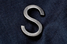 “S”