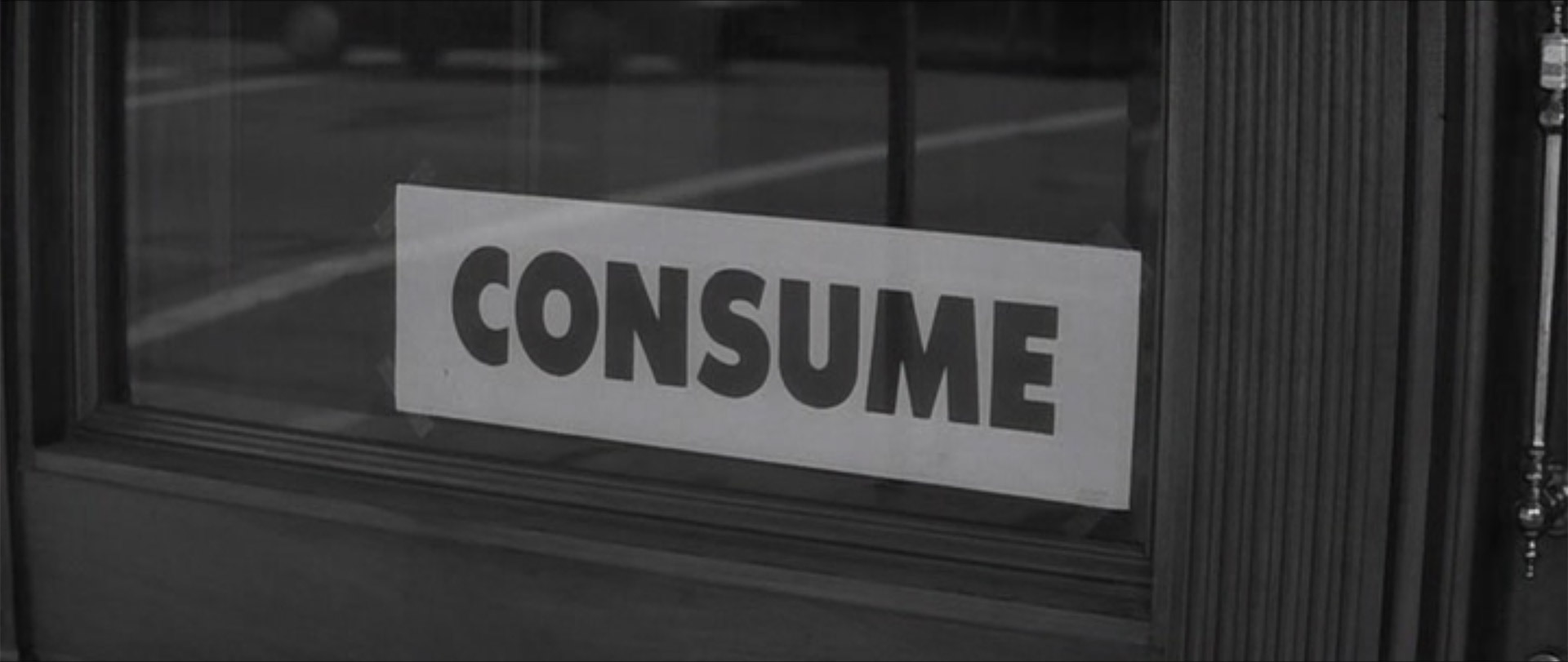 Screenshot from the movie They Live, showing a sign with the word: Consume