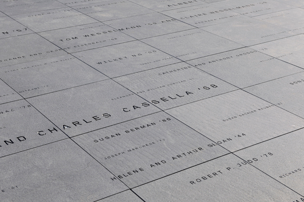 Donor signage on the building's roof terrace appears as a constellation of names engraved in granite.