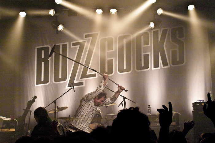 An outlined version of the logo, used as stage decoration at a Buzzcocks concert in 2010.