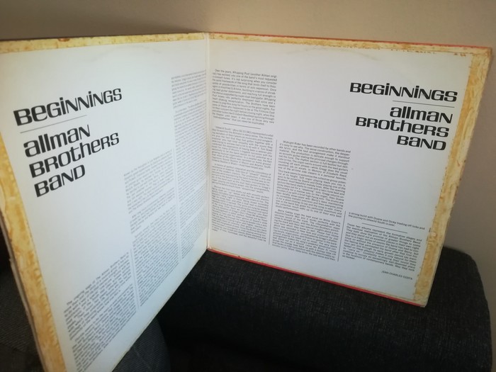 The liner notes are arranged in a peculiar symmetrical layout.