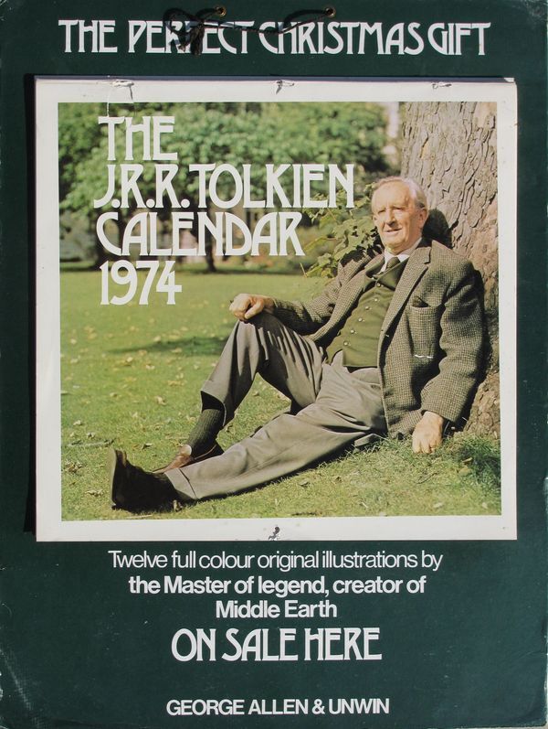 A store advertisement for the J.R.R. Tolkien calendar. Calendar attached to a heavy weight cardboard with fold-out stand on the back and black string for hanging.