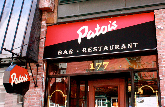 Façade of the follow-up on 177 Mulberry Street, with new signs and “Bar • Restaurant” in . Note the missing close shade on the sign above the entrance.