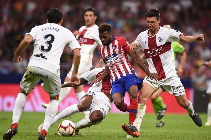 25 September 2018. Match between Atletico de Madrid (striped shirts) and Huesca (white). The guidelines obviously do not forbid sponsor logos outside the designated area for names and numbers.