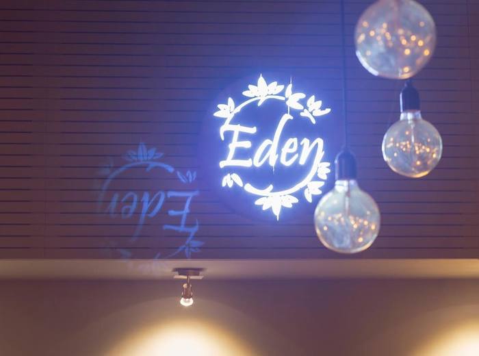 Illuminated logo inside the restaurant.