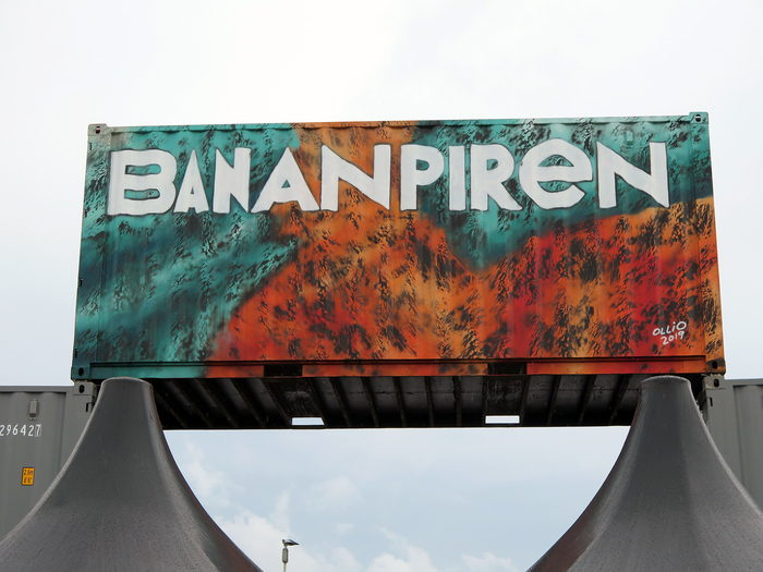 Spray painted signage by Ollio (Jonathan Josefsson) on container-built entrance for Way Out West’s Bananpiren (Banana pier) venue in Gothenburg