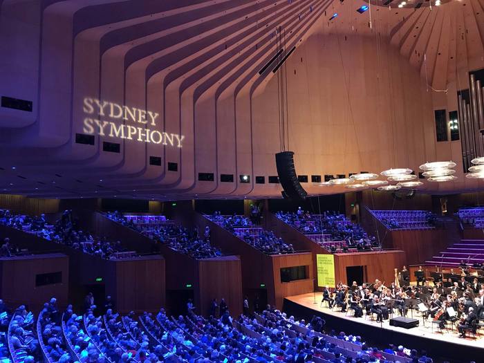 Abridged version of the new logo, projected onto the wall of the Concert Hall of the Sydney Opera House.