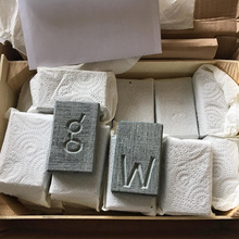 Art packages with chiseled letters