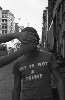 “Art Is Not A Crime” shirt in <cite>Style Wars</cite> (1983)