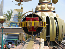 Tomorrowland signs at Disneyland Park and Magic Kingdom