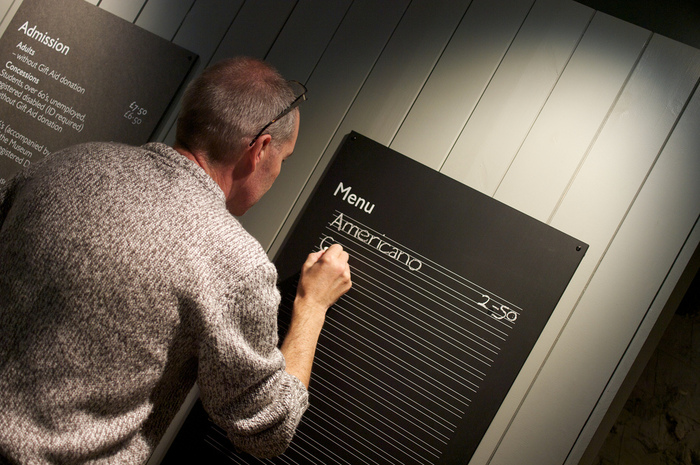 Writing the menu just prior to opening to the public 21 September 2013.&nbsp;Photo: Jackie Baines.