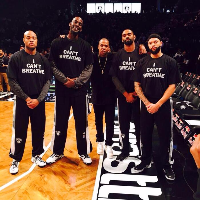 Jarrett Jack, Alan Anderson, Deron Williams and Kevin Garnett of the Brooklyn Nets also wore shirts with this message, albeit rendered in a different typeface (probably ITC Franklin Gothic).