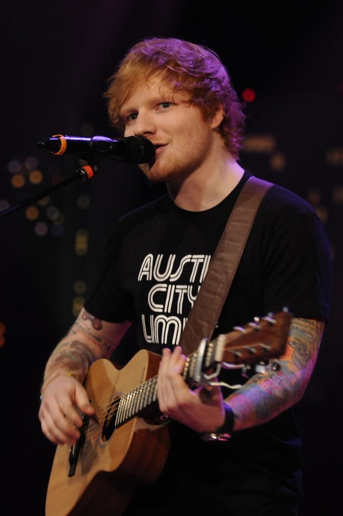 Singer Ed Sheeran performing at Austin City Limits while wearing an ACL shirt.