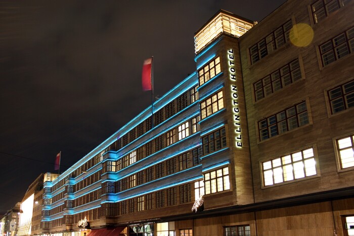 The illuminated sign on the facade uses caps from a wider style of Knockout.