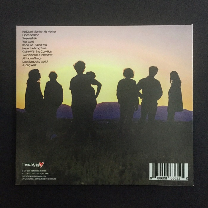The back cover, with a sunset casting the band in silhouette.