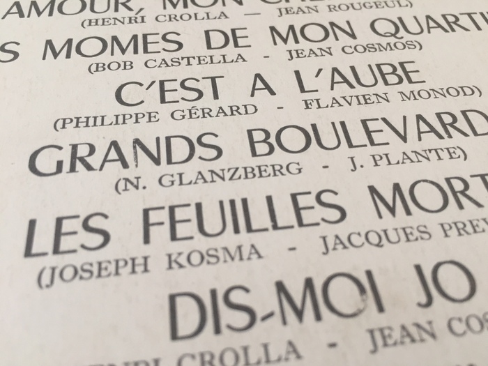 Song titles set in Chambord, with an accidental serif R in “Grands”. Names of authors/composers in Caslon?