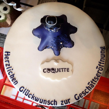 <cite>Coquette</cite> opening celebration cake