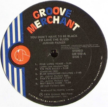 Groove Merchant logo and record labeling