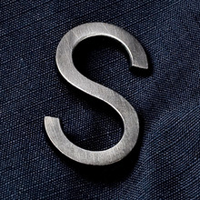 “S”