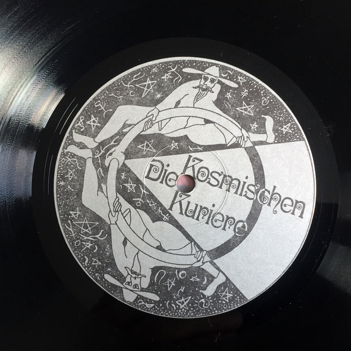 Record label on the B side, showing two Kosmische Kuriere set in Ringlet. on the back of the record sleeve, the Kuriere are translated to English as “Cosmic Couriers” and “Cosmic Couriers Production”.