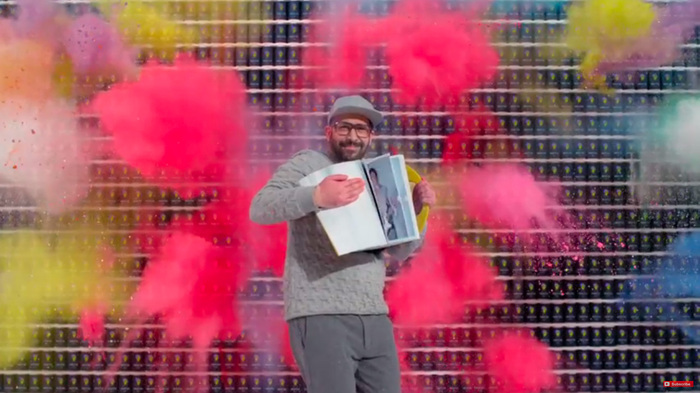 The video is shot in state-of-the-art slow motion and features fireworks of analog visual effects including explosions of color powder, surges of paint, scattering water balloons, and guitars flying into pieces.
